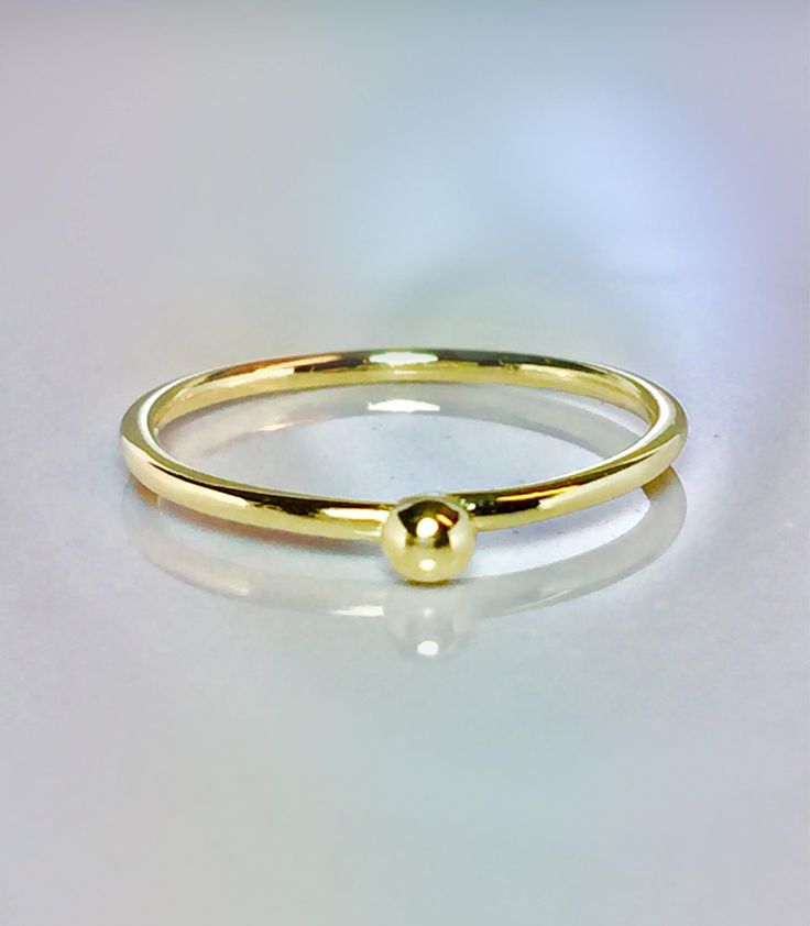 Cute and Dainty solid gold droplet ring Great for baby/children and adults fingers Very sparkly Pave diamond cut or smooth polished finish. **Gold: 14k/10k Real Solid Gold **Thickness approx : 1.0mm **Droplet size: 2.0mm Sturdy and well designed and great for any occasion. **Order yours Today! Minimalist 14k Gold Teardrop Ring, Gold Teardrop 14k Gold Ring, Minimalist Teardrop Gold Ring, Tiny Gold Birthstone Ring With Round Band, Adjustable Yellow Gold Teardrop Rings, Adjustable Teardrop Yellow Gold Ring, Simple Hypoallergenic Yellow Gold Ring, Dainty Teardrop Gold Ring, Gold Teardrop Birthstone Ring For Promise