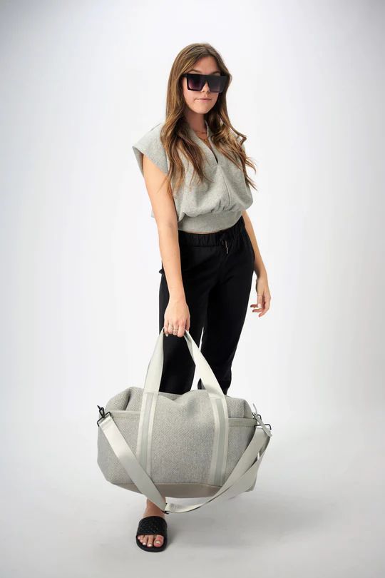 Lightweight and modern gray neoprene on the outside, organized on the inside, this duffel bag is ready for wherever you want to take it. It has an interior padded sleeve, removable shoulder strap, generous exterior pockets and finished with our signature gray leather trim. Straw Bags, Gray Leather, Sport Bag, Grey Leather, Duffel Bag, Leather Trim, Rebecca Minkoff Hobo, Leather Trims, Athleisure