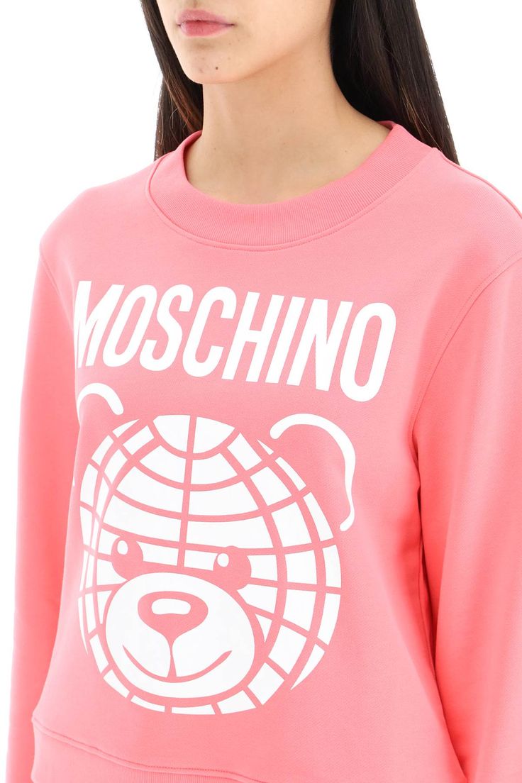 Cropped-cut crew-neck sweatshirt in loop-back cotton jersey by Moschino, featuring the Teddy branded print on front. Regular fit, ribbed edges. The model is 177 cm tall and wears a size IT 38. Size Info IT Color Detail Pink Made In Portugal Material 100% CO Season One spring Season Two summer Product clothing Brand Moschino Size And Fit Trench Dress, Cape Coat, Ermanno Scervino, Knitwear Cardigan, Pant Shirt, Crop Sweatshirt, Spring Season, Roberto Cavalli, Jeans Dress