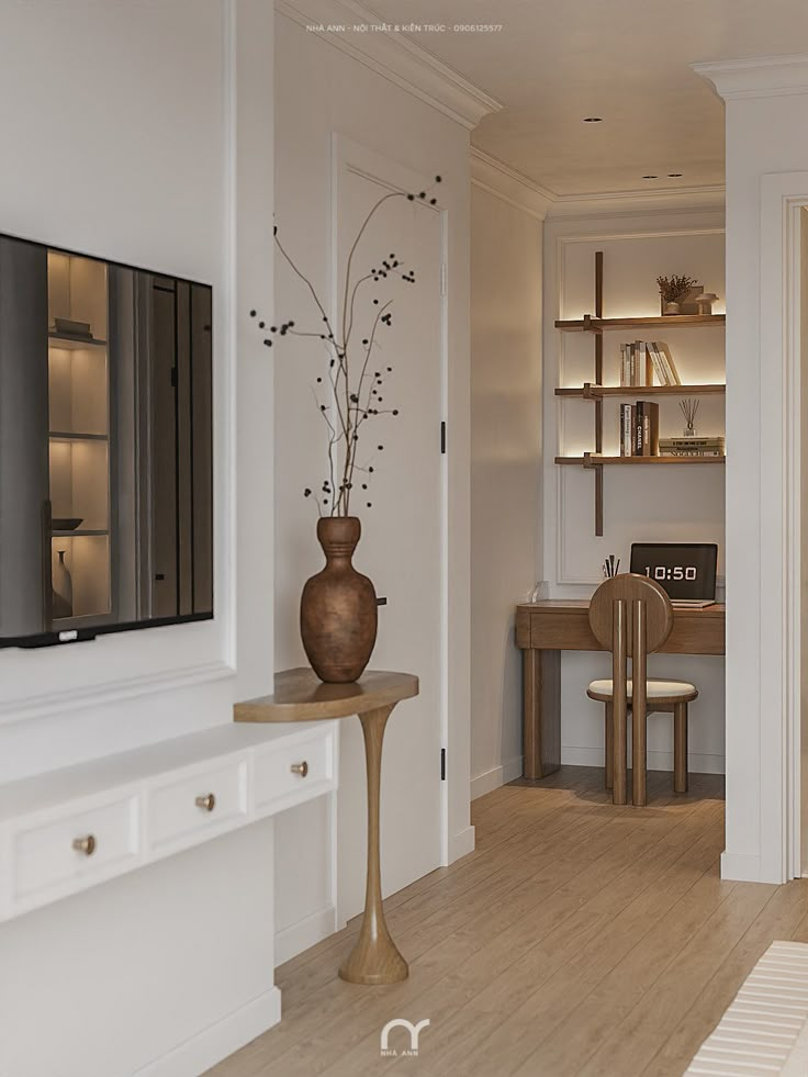 a vase with flowers is sitting on a table in front of a television set and bookshelves