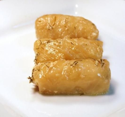 three pieces of food sitting on top of a white plate