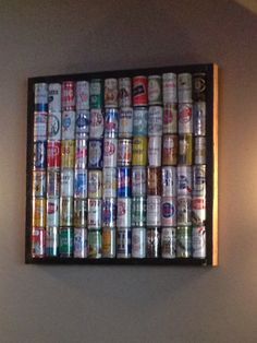 a bunch of cans that are on a wall