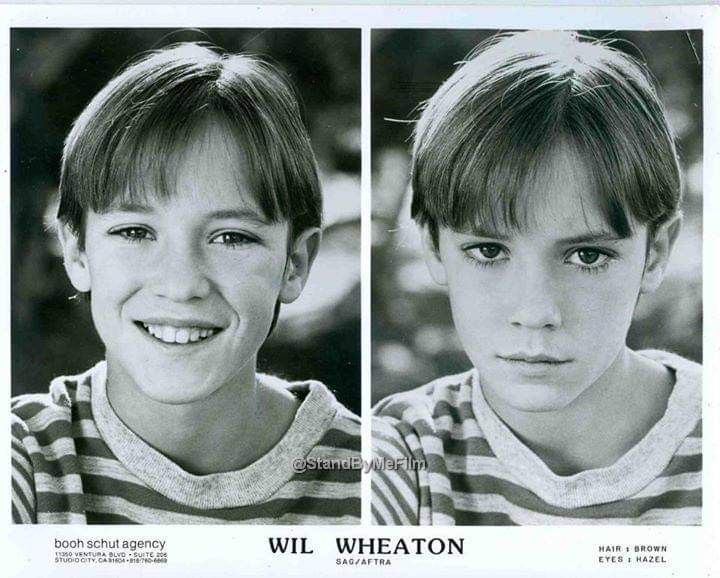 two young boys are shown in black and white, one is wearing a striped shirt