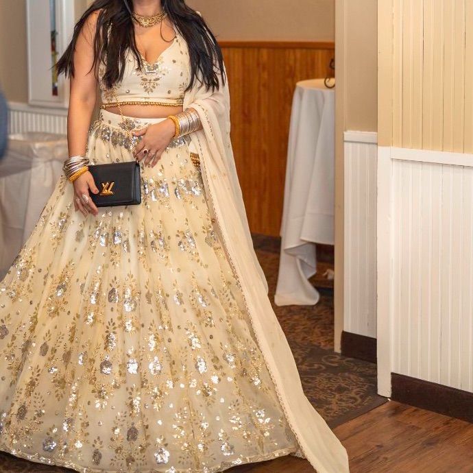 Worn Once In My Reception For 4-5 Hours, Very Good Condition, Blouse Fits Up To 85b Or 37" Inch Bust, Can Be Altered As Required, Lehenga Is One Size Fits All.Dont Have Many Photos If You Want More Videos I Can Send More. Elegant Sequined Traditional Wear For Weddings, Elegant Sequined Traditional Wedding Wear, Glamorous Traditional Wear For Wedding And Festivals, Glamorous Wedding Festival Dress, Glamorous Formal Lehenga With Sheer Dupatta, Bollywood Style Formal Sequined Lehenga, Gold Lehenga With Sheer Dupatta For Ceremony, Bollywood Style Formal Lehenga With Sequins, Glamorous Semi-stitched Wedding Dress