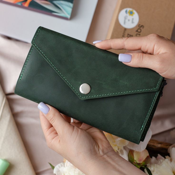 If you are looking for more leather accessories - welcome to my store https://www.etsy.com/shop/SquirrelsBags Womens leather wallet | Long wallet big |Green leather wallet | Green leather purse - gifts for her. A lovely, deep green women's wallet handmade from high quality leather. This beautiful, bright wallet will attract money with its lucious color :) It is long, so that you don't have to fold your money. It has a zipper section in the middle, for wallet mice and loose change. The button at Green Wallet, 40th Birthday Gifts For Women, Fun Wallets, Card Purse, Cute Wallets, Loose Change, Handmade Leather Wallet, Wallets For Women Leather, Personalized Wallet