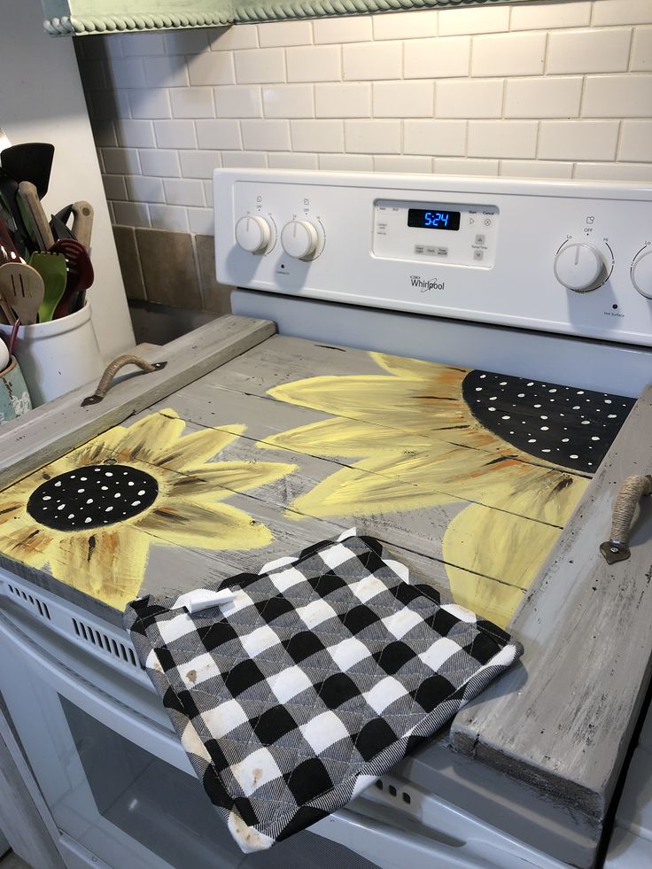 an oven with sunflowers painted on it