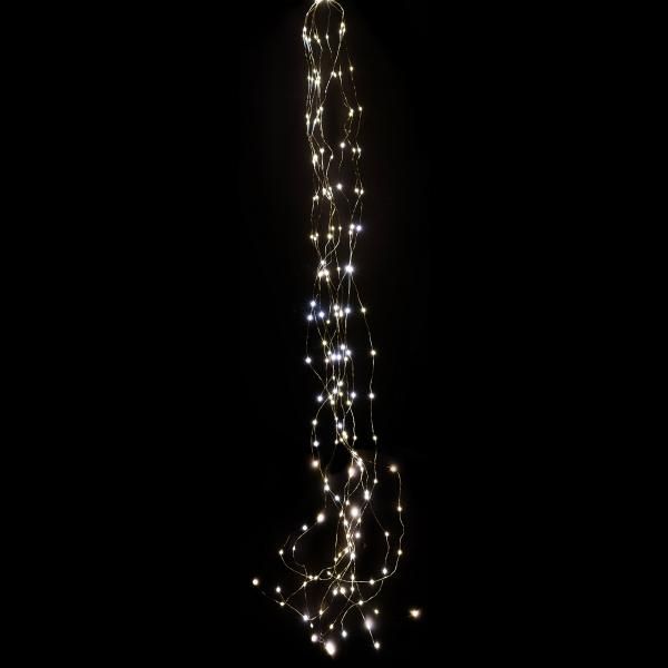 a long string of lights hanging from the side of a building in the night time