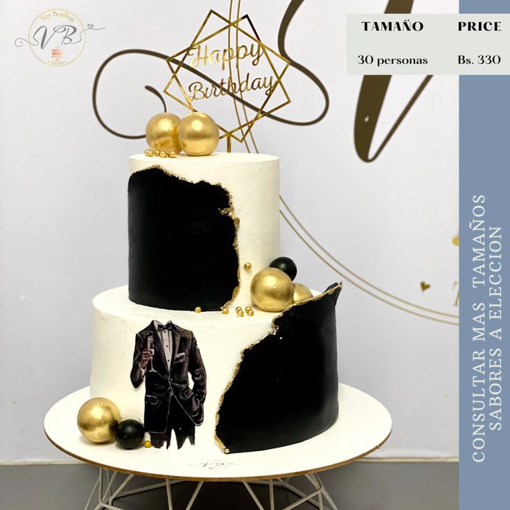 a white and black cake with gold decorations