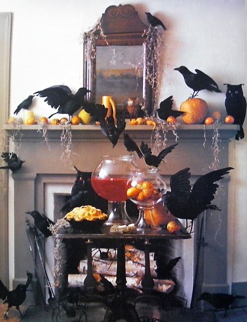 halloween decorations in front of a fireplace with bats