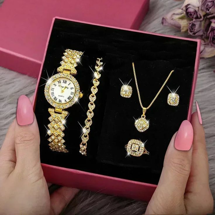 Product Features: The Fashion Luxury Full Crystal 5 Pcs Gift Set is adorned with dazzling crystals, adding a touch of opulence and glamour to each piece. The set includes a necklace, earrings, bracelet, ring, and a matching watch, creating a cohesive and luxurious ensemble. Suitable for various occasions, each piece in the set complements both casual and formal attire, offering versatility in styling. Crafted from high-quality materials, the set ensures durability, resistance to tarnishing, and Joker Fashion, Mirror Material, Rhinestone Watches, Luxury Bracelet, Crystal Jewelry Sets, Rose Gold Watches, Fashion Jewelry Sets, Rose Gold Bracelet, Rose Gold Watch