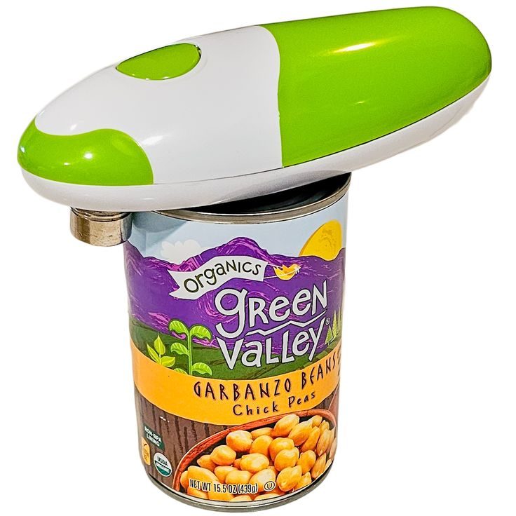 a green and white container with food in it on top of an object that looks like a mushroom