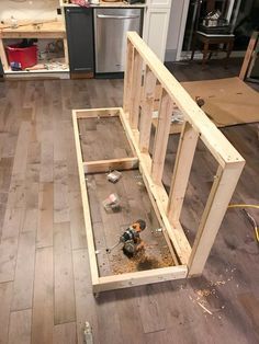 an unfinished kitchen with wood flooring and cabinets in the process of being built by someone