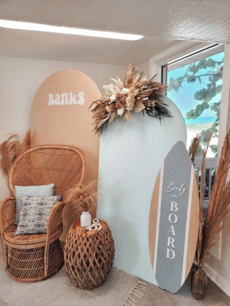 a room that has some chairs and a surfboard on the wall in it,