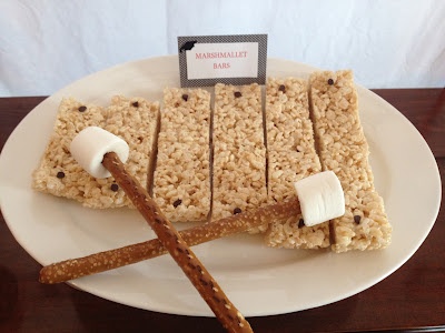 some kind of food on a plate with marshmallow bars