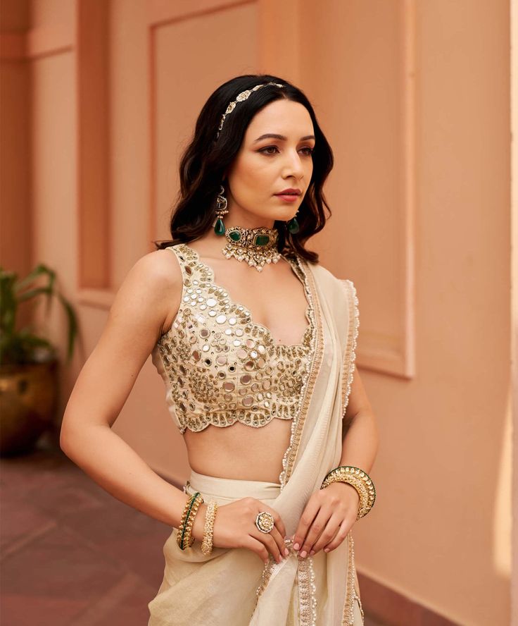 Introducing this exquisite ivory tissue lehenga sari, adorned with intricate mirror work embroidery on the blouse. This stunning ensemble seamlessly blends traditional charm with contemporary elegance, perfect for making a lasting impression at any special occasion. Tissue Lehenga, V Neck Lehenga, Intricate Mirror, Lehenga Sari, Mirror Work Embroidery, Drape Saree, Lehenga Saree, Blouse For Women, Mirror Work