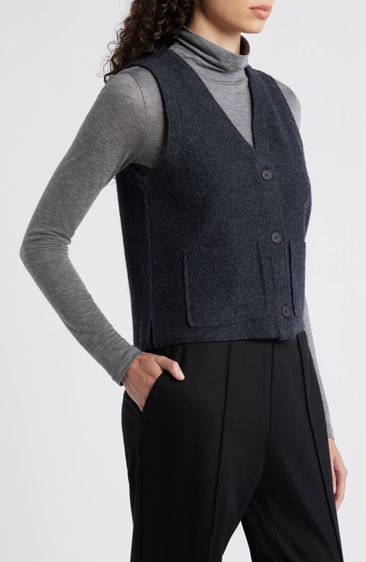 A versatile layering piece, this sculptural button-front vest is crafted from boiled wool for a soft, felted feel. 22" length Front button closure V-neck Front patch pockets 100% wool Dry clean Imported Wool Vest With Pockets For Tailoring, Casual Merino Wool Sleeveless Sweater Vest, Casual Sleeveless Merino Wool Vest, Tailored Single-breasted Wool Vest, Wool Single-breasted Fitted Vest, Wool Vest, Boiled Wool, Eileen Fisher, Fabric Gift Bags