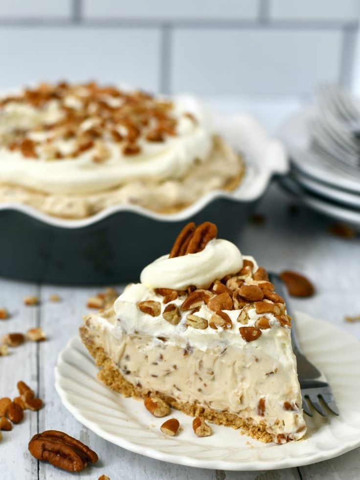 a slice of pecan pie on a white plate