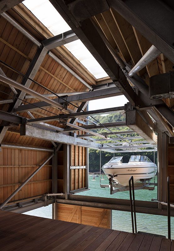 a boat is docked in the water under a roof