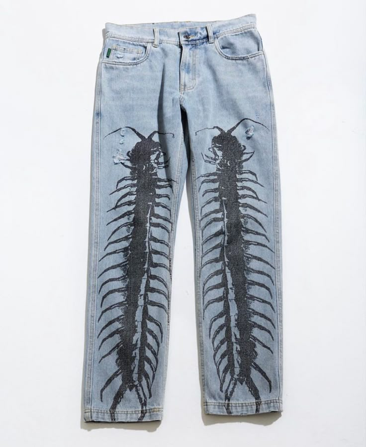 a pair of blue jean pants with an image of a scorpionfish on it's back