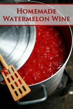 homemade watermelon wine in a pot with a wooden spatula