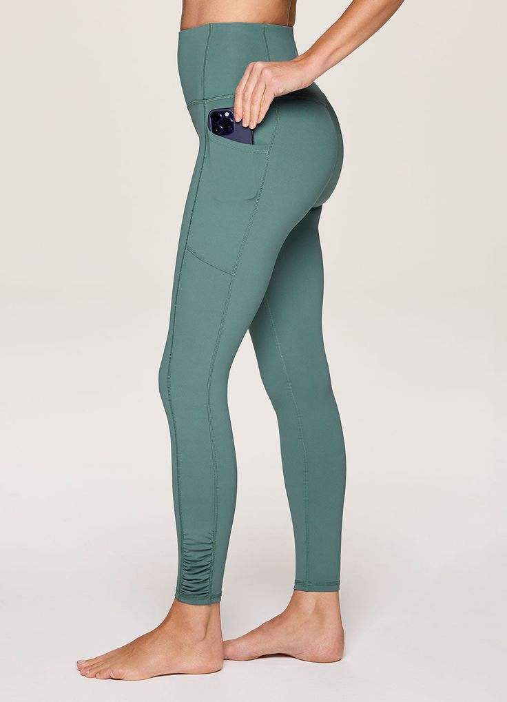 Take on your active lifestyle with ease and style with our In Renewal Ruched Legging. Constructed from our smooth, quick-drying Tech Flex fabric with four-way stretch, these full length, moisture wicking leggings provide light compression and full range of motion while maintaining the squat-proof properties you're looking for. Large side pockets conveniently hold all of your essentials, and a seamless high rise waistband offers both a supportive and flattering fit. Complete with side ruching det Sporty Breathable Leggings In Recycled Polyester, Moisture-wicking Solid Yoga Pants For Running, Versatile Recycled Polyester Yoga Pants For Gym, Versatile Recycled Polyester Yoga Pants For Workout, Breathable Recycled Polyester Yoga Leggings, Full Length Recycled Polyester Activewear For Workout, Full-length Recycled Polyester Activewear For Workout, Full Length Moisture-wicking Athleisure Leggings, Breathable Recycled Polyester Leggings For Yoga