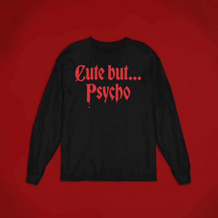 The 'Cute But Psycho' shirt is perfect for any horror fan! Whether you're looking for a gift for yourself or someone else, this t-shirt is sure to make them pull out their kitchen knife. Available in unisex sizes, this shirt is perfect for anyone who loves dark grunge fashion. Wear it while watching scary movies or while trick-or-treating. ⚰️ 100% airlume combed and ringspun cotton (fiber content may vary for different colors) ⚰️ Light fabric (4.2 oz/yd² (142 g/m ⚰️ Retail Fit ⚰️ Tear away label Horror Graphic Print Long Sleeve T-shirt, Red Long Sleeve T-shirt For Halloween, Funny Fan Merchandise Tops With Long Sleeves, Funny Long Sleeve Tops For Fan Merchandise, Funny Long Sleeve Fan Merchandise Top, Horror Style Long Sleeve Tops For Streetwear, Halloween Band Merch Shirt, Halloween Horror Long Sleeve T-shirt, Band Merch Shirt For Halloween