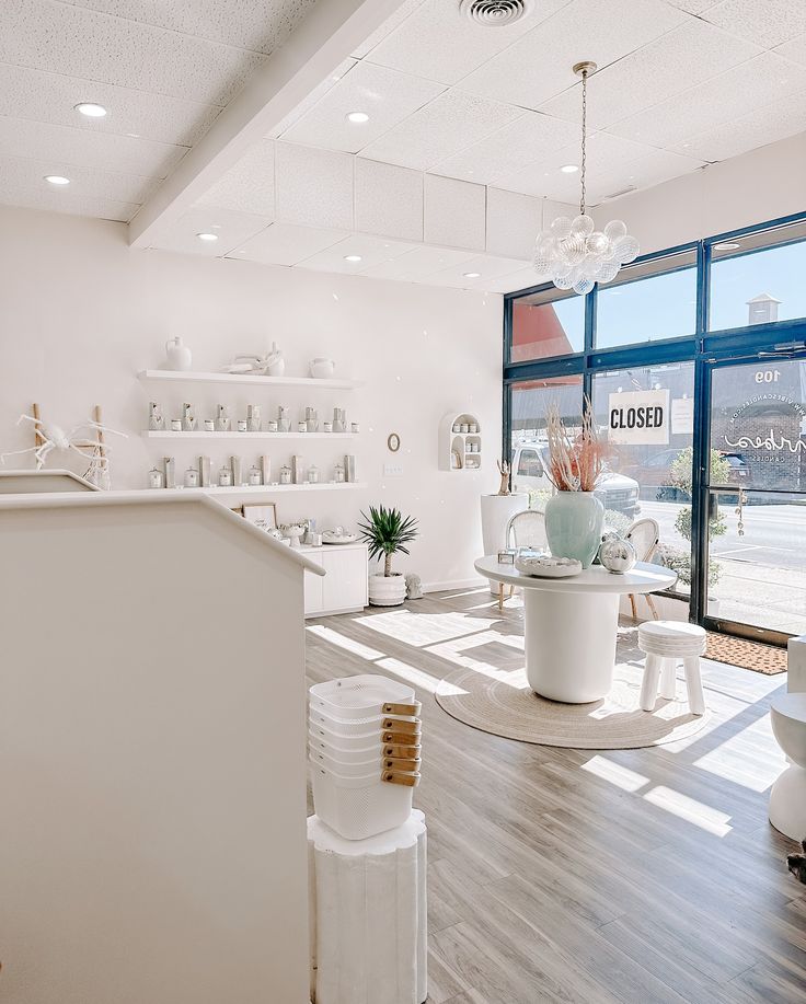 the inside of a store with large windows