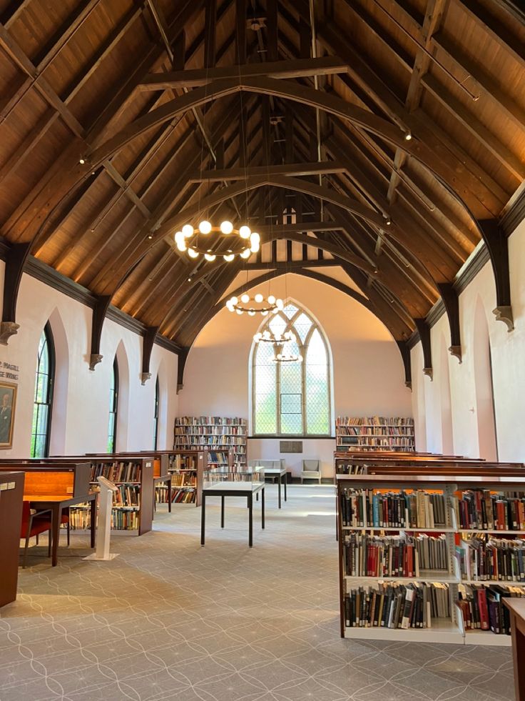 the inside of a large library with lots of books