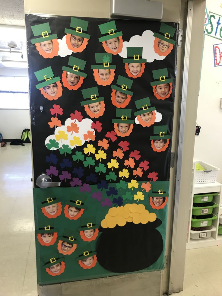 a door decorated with st patrick's day pictures and shamrocks for the classroom