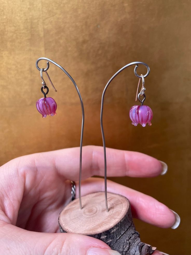 These little blossom earrings are made from translucent pink glass and are durable and lightweight. These would be a great pair of earrings for someone who needs extremely lightweight earrings or for somebody's first pair of dangling earrings. Celebrate spring! The ear wires are solid sterling silver which is safe for most people with metal allergies. Pink Sterling Silver Flower Earrings For Gift, Pink Sterling Silver Flower Earrings As Gift, Pink Hypoallergenic Sterling Silver Flower Earrings, Hypoallergenic Pink Flower Earrings In Sterling Silver, Pink Sterling Silver Hypoallergenic Flower Earrings, Pink Sterling Silver Dangle Flower Earrings, Nickel-free Pink Sterling Silver Earrings, Pink Adjustable Flower Earrings With Ear Wire, Adjustable Pink Flower Earrings With Ear Wire