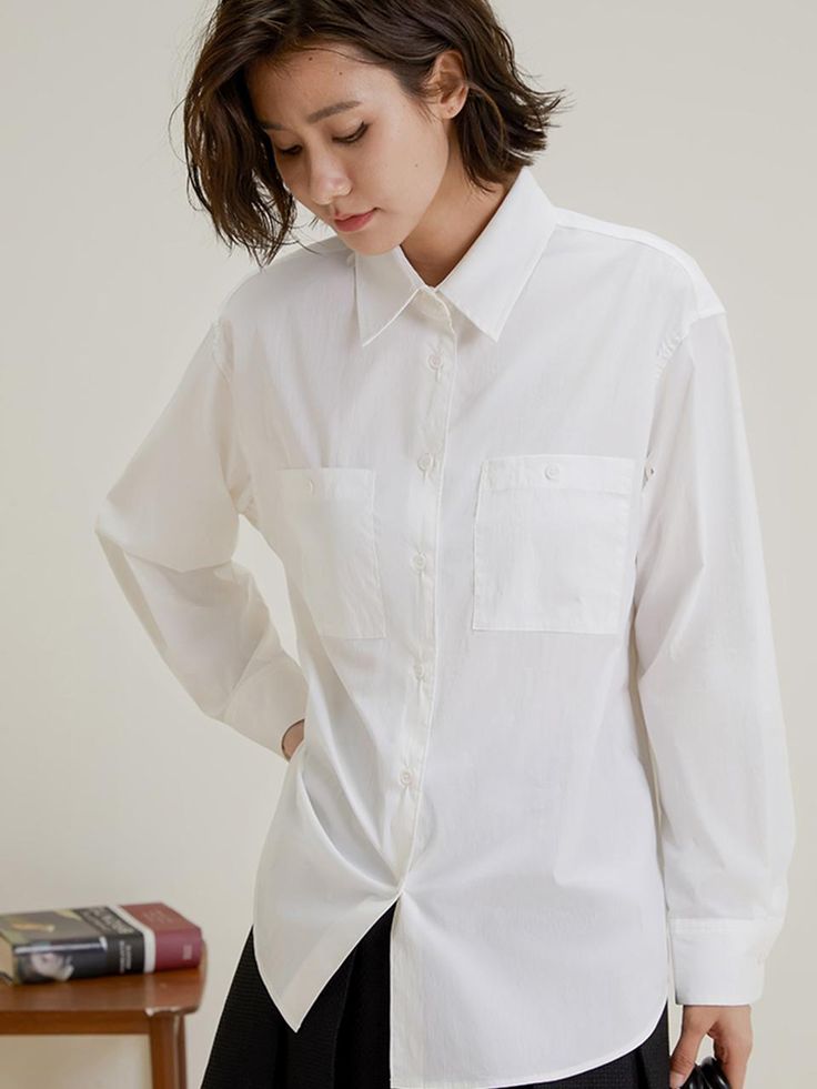 This is a feminine and romantic top by LANGSON that is made out of high quality cotton and polyester blend fabric. With design detail of clean and classic silhouette and chest patch pockets, it gives a trendy and feminine look.- Chest patch pockets with buttons- Pleats detail on the cuffs- Feminine and modern mood Solid Color Long Sleeve Tops With Patch Pockets, Solid Long Sleeve Tops With Patch Pockets, Classic Long Sleeve Tops With Buttoned Pockets, Collared Office Tops With Buttoned Pockets, Office Tops With Collared Buttoned Pockets, Relaxed White Tops With Patch Pockets, White Relaxed Fit Top With Patch Pockets, White Tops With Patch Pockets In Relaxed Fit, Collared Tops With Buttoned Pockets For Office