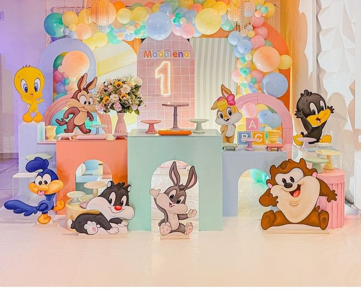 an assortment of cartoon characters on display at a birthday party