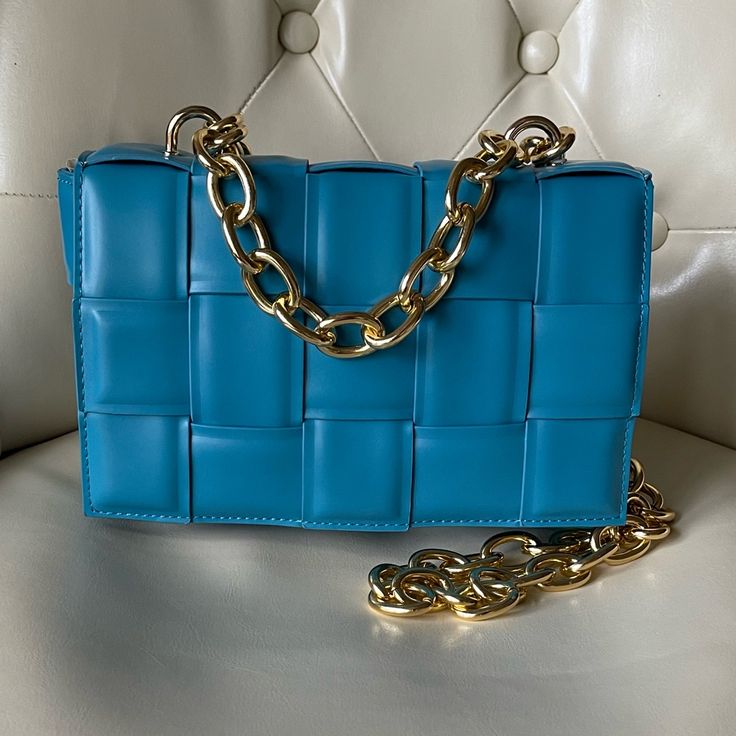 -Luxury Style Handbag With Goldtone Top Chainstrap And Crossbody Chainstrap -Teal Color Perfect For Spring/Summer -Measures Approximately 8.5”X5”X2”; 4.5” Drop Top Handle Chainstrap And 20” Drop Crossbody Chainstrap -Detachable Interior Zippered Pouch Formal Blue Shoulder Bag With Chain Strap, Blue Evening Bag With Chain Detail, Chic Blue Bag With Chain Strap, Luxury Blue Bag With Chain Detail, Luxury Blue Bags With Chain Detail, Luxury Blue Bags With Chain, Formal Blue Bag With Chain, Luxury Blue Chain Bags, Blue Square Bag With Chain Strap