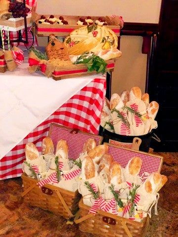 several baskets filled with bread and pastries sitting on top of a carpeted floor