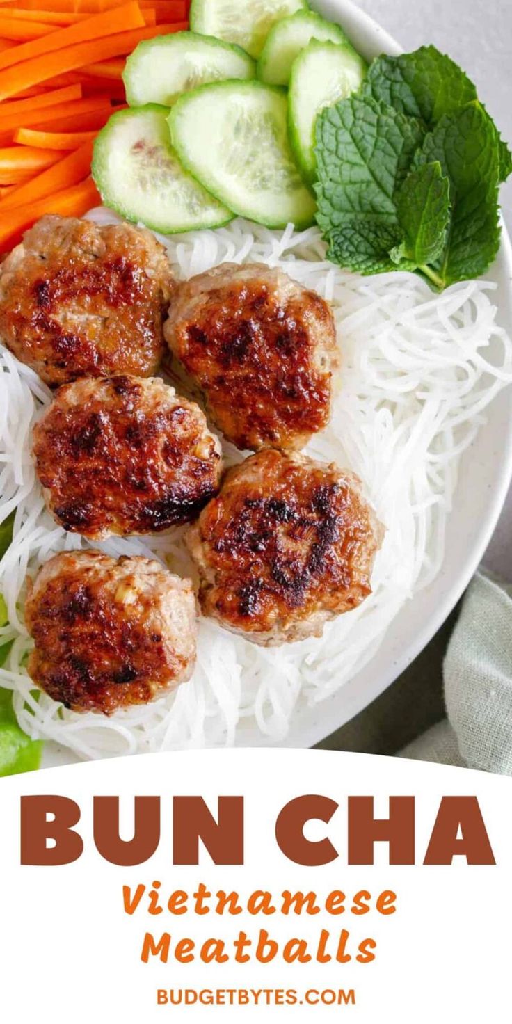 bun cha vietnamese meatballs with noodles and cucumbers on the side in a white bowl