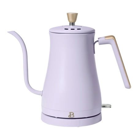 a white coffee pot with a wooden handle