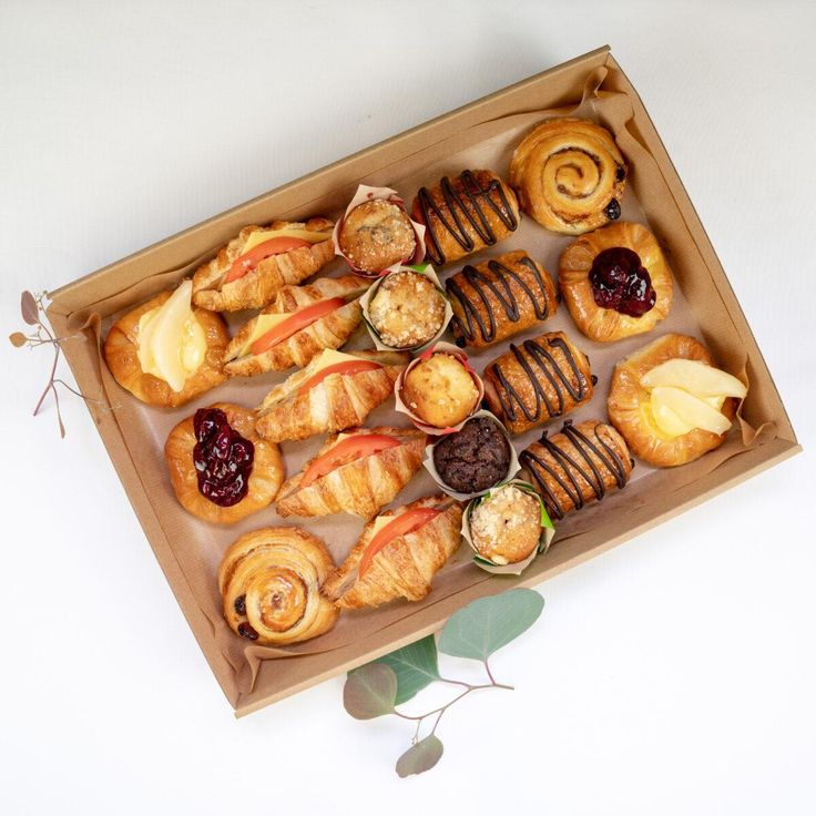 a box filled with pastries on top of a table