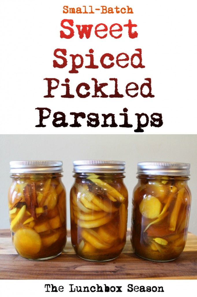 three jars filled with pickled parsnips on top of a wooden table