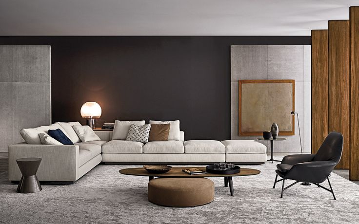 a living room filled with white furniture and brown walls