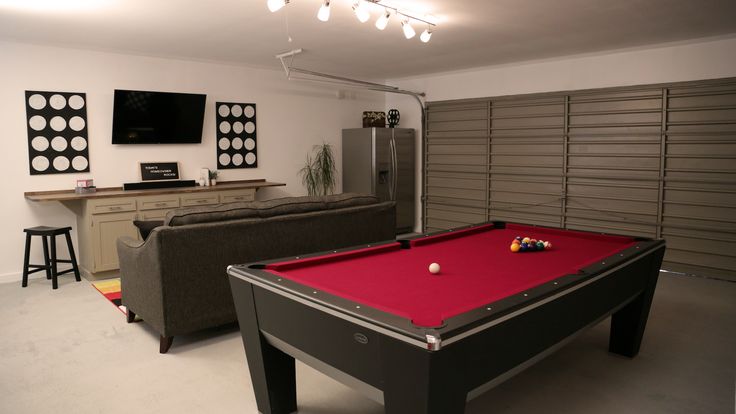 a pool table in the middle of a living room