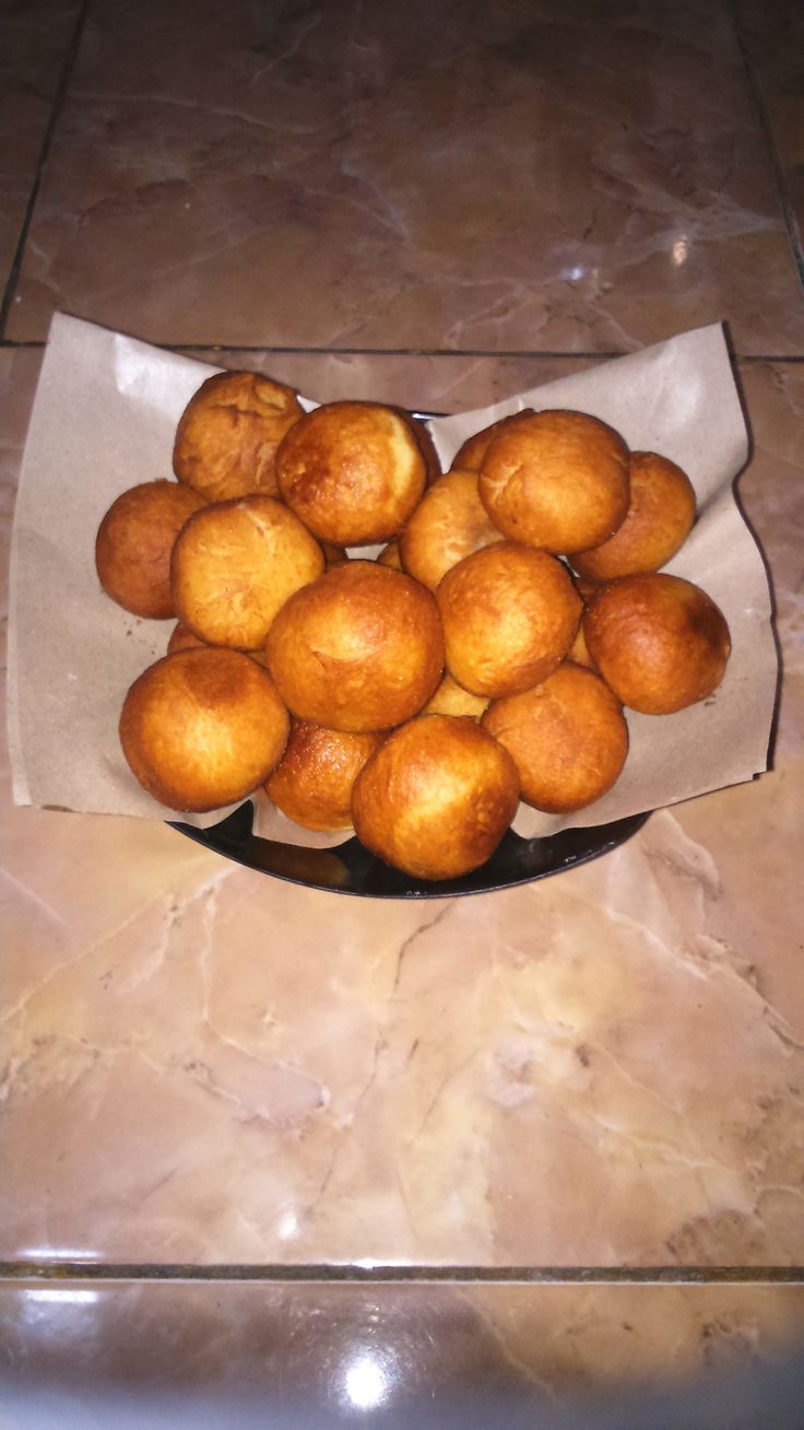 a bowl filled with bread on top of a counter