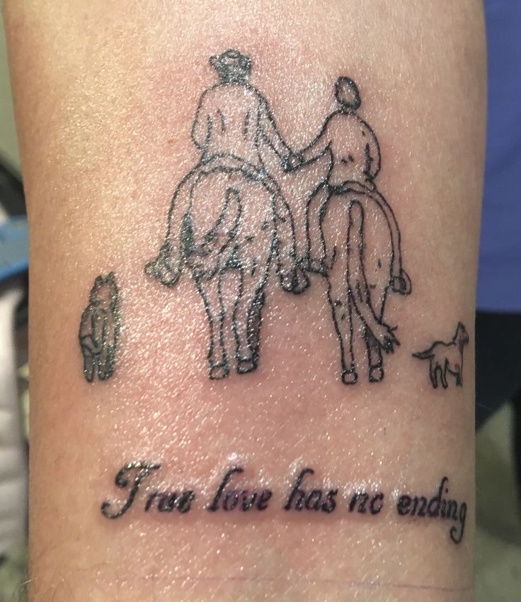 a tattoo with an image of two men riding horses and the words trust love has no ending