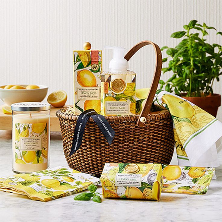 a wicker basket filled with lemons and body care products sitting on top of a counter