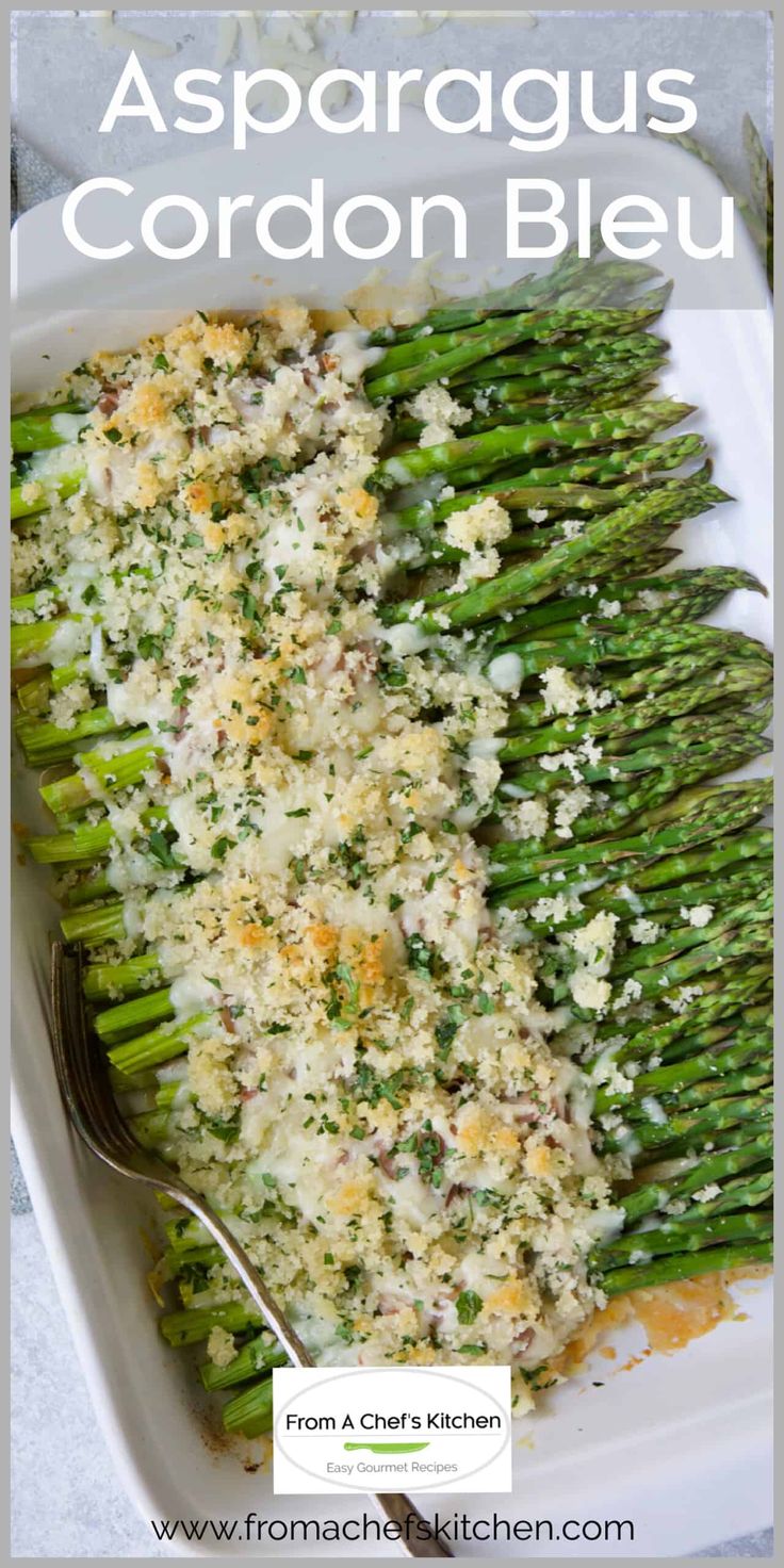 asparagus cordon bleu with parmesan cheese on top in a casserole dish