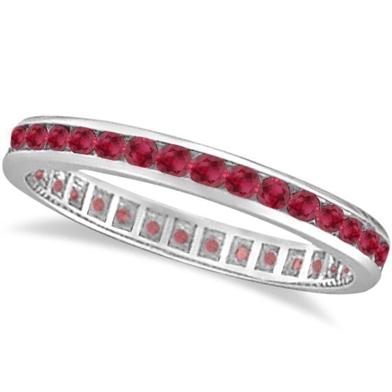 a white gold ring with red stones