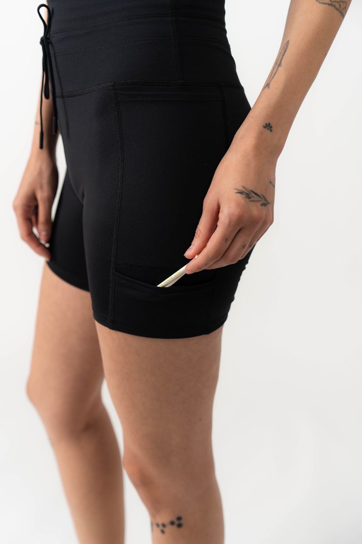 Three pockets, a perfect high-rise, and an elastic band for your glove... these shorts are ready for anything. This product is on Final Sale. Functional Black Bottoms With Built-in Shorts, Black Compression Athletic Shorts With Elastic Waistband, Stretch High-waisted Shorts With Pockets, Sports Biker Shorts With Pockets, Black Sports Skort With Built-in Shorts, Functional Short Bottoms With Hip Pockets, Black Compression Athletic Knee-length Shorts, Black Compression Knee-length Athletic Shorts, Compression Black Biker Shorts With Elastic Waistband