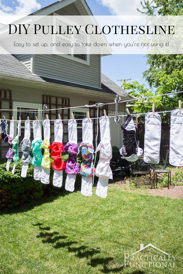 clothes hanging on a line in front of a house with the words diy pulley clothesline