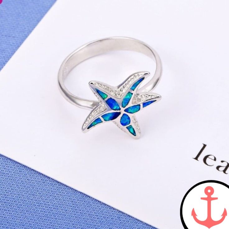 Introducing the Blue Starfish Ring: The Perfect Symbol of the Sea As passionate sea lovers, we are always on the hunt for beautiful and meaningful pieces of jewelry that reflect our deep connection to the ocean. That's why we are thrilled to present the Blue Starfish Ring—a stunning piece that captures the essence of the sea in every detail. Whether you're a seasoned sailor or simply someone who appreciates the beauty of marine life, this ring is the perfect addition to your collection. Our Star Ocean-inspired Sterling Silver Starfish Jewelry, Ocean-inspired Promise Ring, Ocean-inspired Blue Ring For Gifts, Ocean-inspired Blue Ring For Gift, Ocean-inspired Blue Rings As Gifts, Ocean-inspired Starfish Jewelry In Ocean Color, Ocean-inspired Starfish Jewelry, Silver Starfish Ring For Gift, Blue Ocean-inspired Jewelry For Anniversary