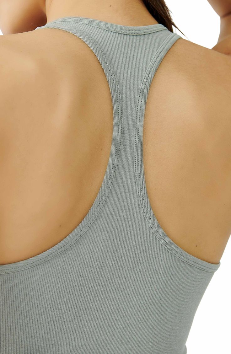 Lounge or layer in this oh-so-versatile ribbed crop top that looks (and feels) great wherever you go. 17" length (size Medium/Large) Crewneck Sleeveless Racerback 92% nylon, 8% spandex Machine wash, dry flat Imported Casual Seamless Crop Top For Loungewear, Casual Ribbed Scoop Neck Sports Bra, Casual Stretch Ribbed Sports Bra, Spring Ribbed Sports Bra For Workout, Trendy Ribbed Sports Bra For Spring, Casual Ribbed Sports Bra For Spring, Trendy Ribbed Fitted Sports Bra, Spring Ribbed Crop Top With Medium Support, Ribbed Crop Top For Gym In Spring