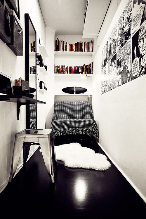 black and white photograph of a small bedroom